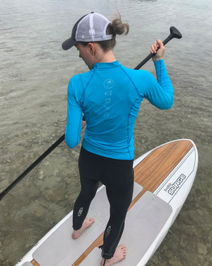 RBR 2Flex women's rash guard on paddler. UPF 50+ Wears cool, dries quick. Geared to perform and formulated for comfort at ridebackwards.com