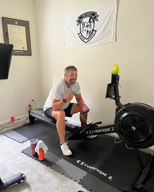 Erg Rats Gym Towel on wall of erg racer. ridebackwards.com